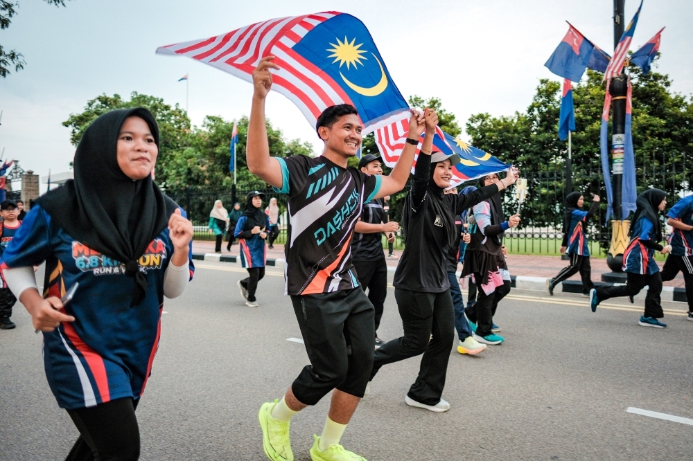 ‘Fly it proudly’: Fahmi Urges Malaysians to Raise Jalur Gemilang in Celebration of Unity and Patriotism